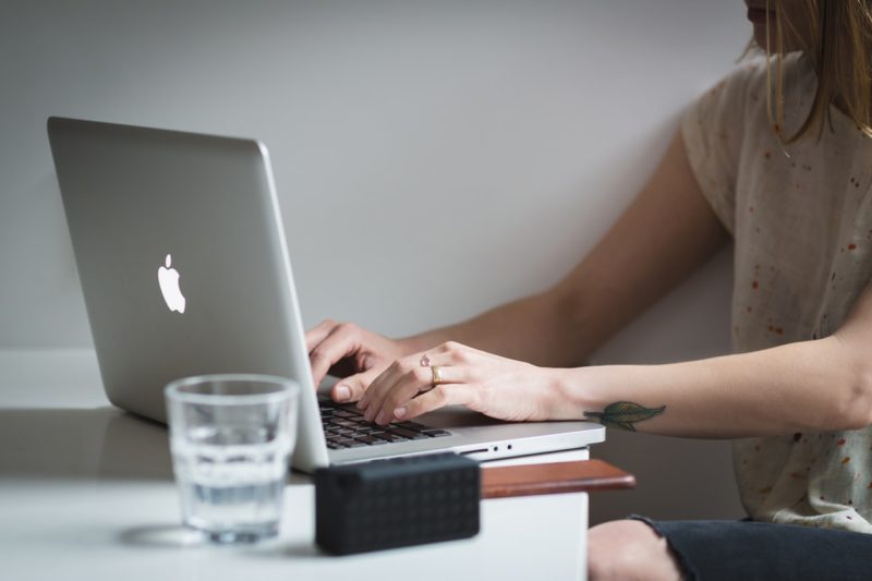 Woman sitting at desk with laptop