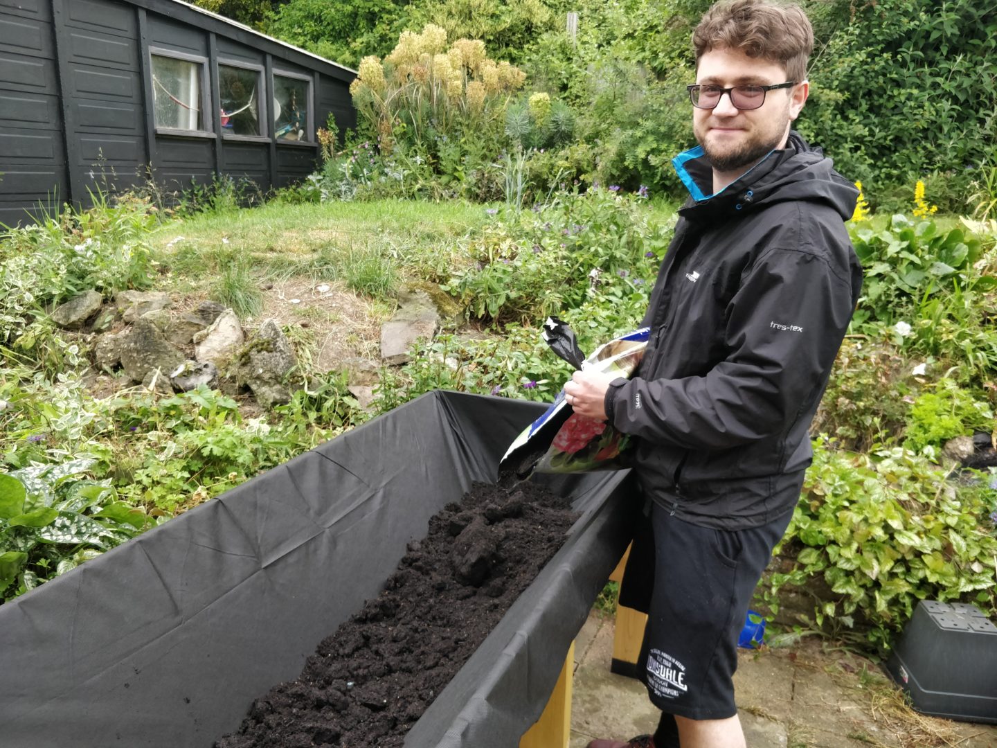 Vlad filling the vegtrug with soil