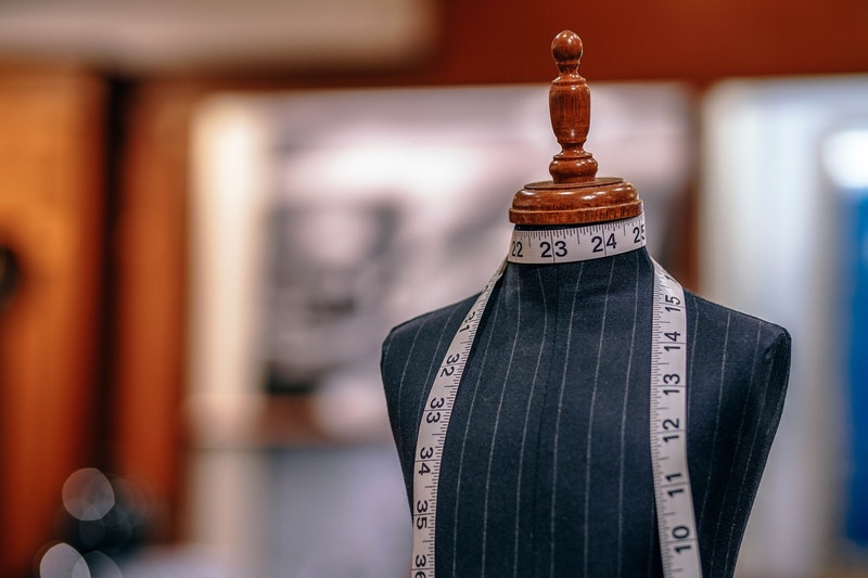 tailor mannequin and tape measure