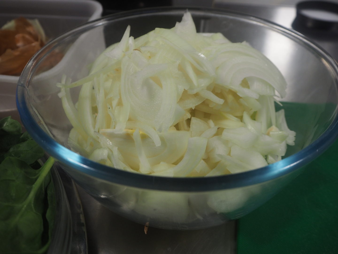 a bowl of sliced onions