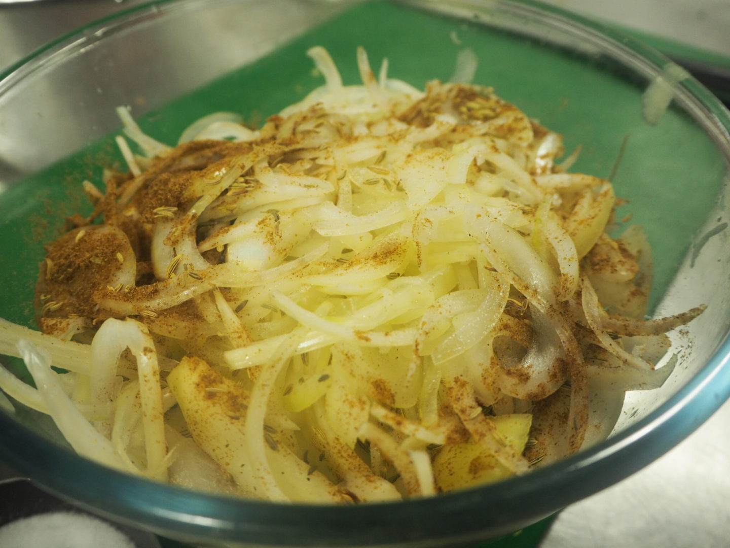 Mixing spices into the onion bhaji mix