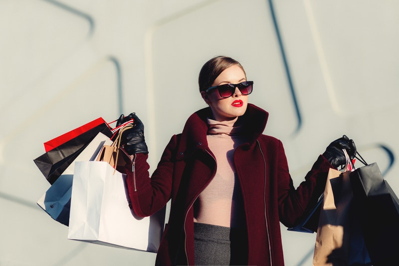 woman with lots of shopping bags