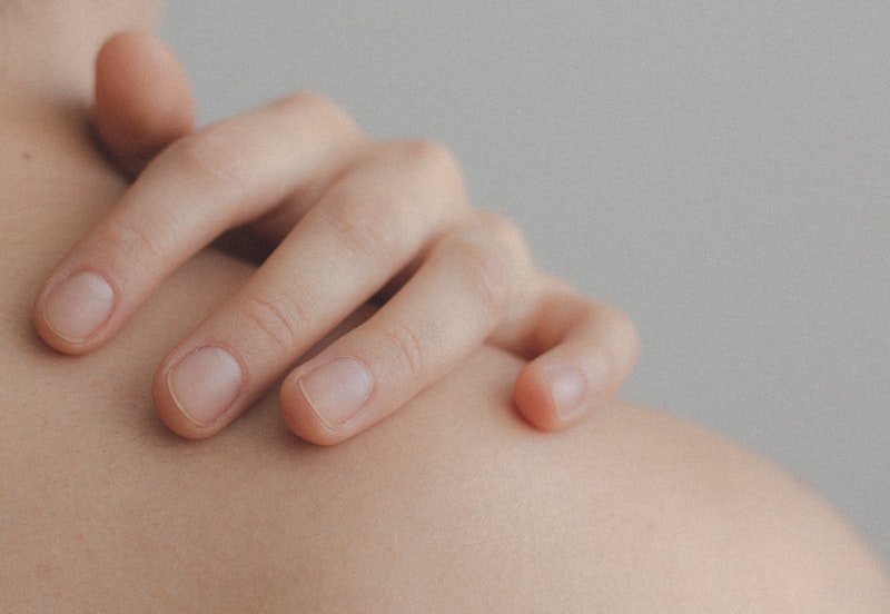 close up of hand and shoulder skin